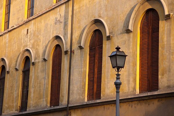 Eggers, Julie 아티스트의 Italy-Tuscany-Lucca Street lamppost and arched windows with wooden shutters작품입니다.